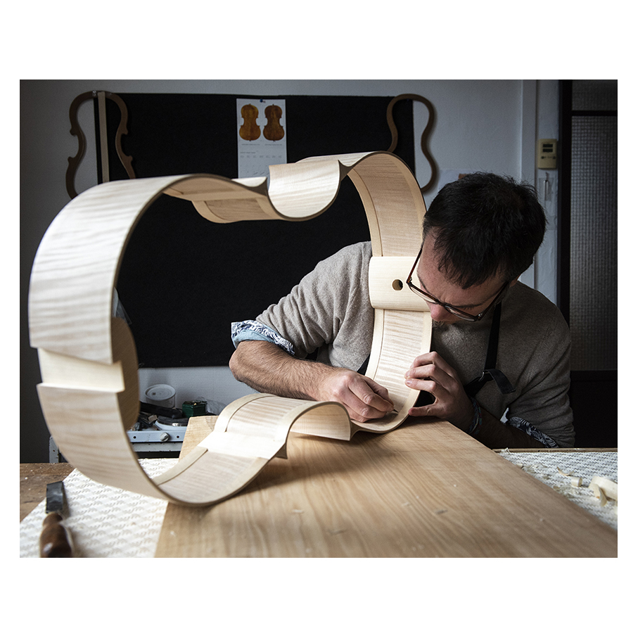 Making Moya's Cello -  The ribs of flamed maple are bent to shape and later on taken out from the mold