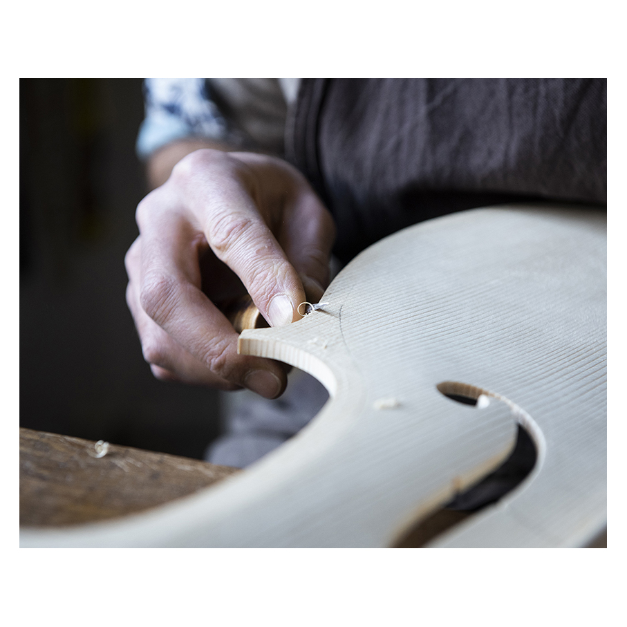 Making Moya's Cello -  The first chamfer of edgework is cut with a knife