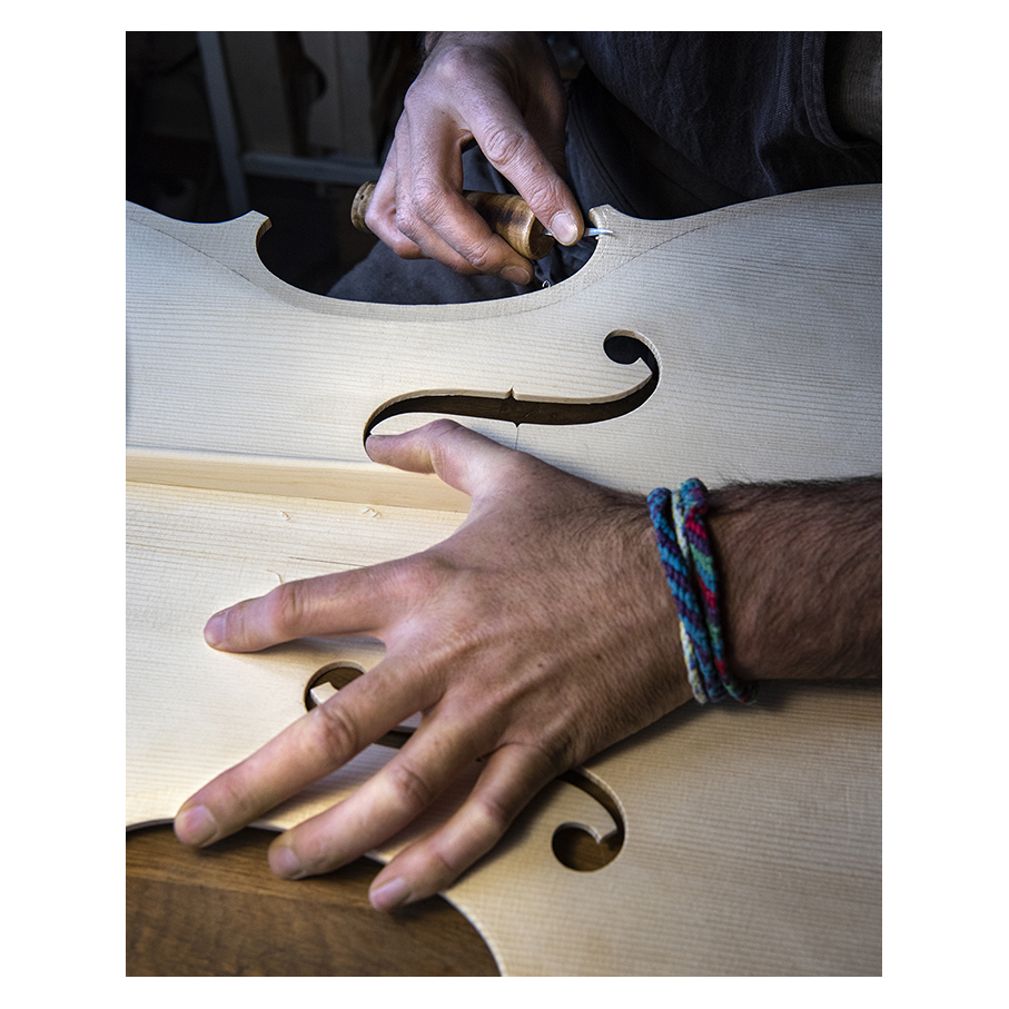 Making Moya's Cello -  The first chamfer of edgework is cut with a knife