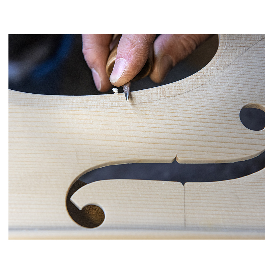 Making Moya's Cello -  The first chamfer of edgework is cut with a knife