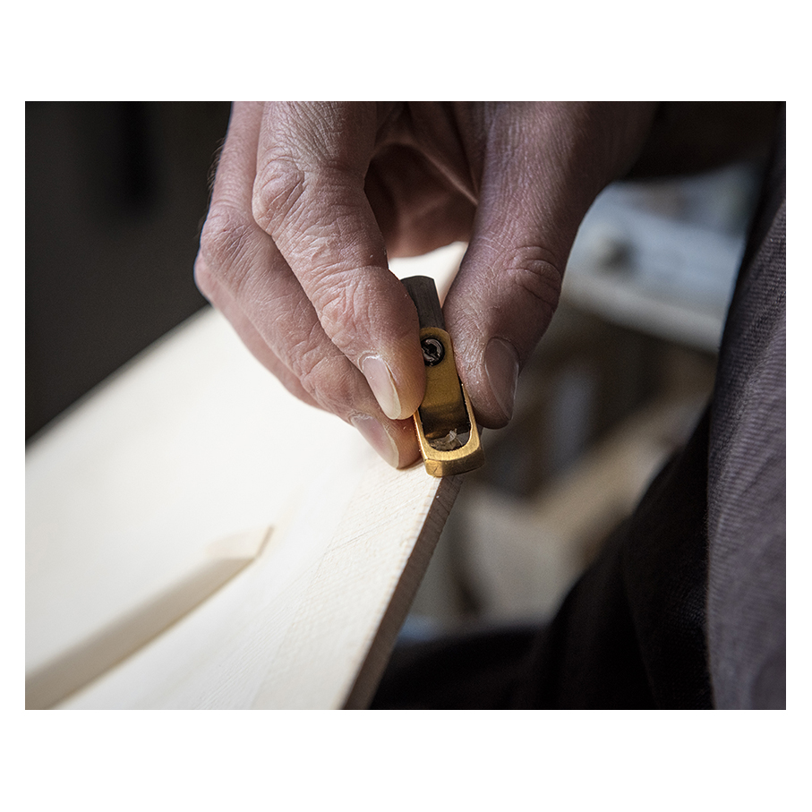 Making Moya's Cello -  The first chamfer of edgework is cut with a knife